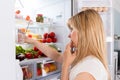 Young Woman Looking In Fridge Royalty Free Stock Photo