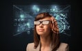 Young woman looking with futuristic smart high tech glasses Royalty Free Stock Photo