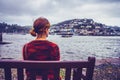 Young woman looking at harbor town