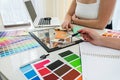 Young woman looking house plans and choice perfect color for renovation house Royalty Free Stock Photo