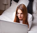 Young woman looking at laptop