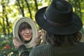 Young Woman Looking in the Mirror In Forest Royalty Free Stock Photo