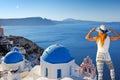 Young woman looking at Oia in Santorini, Greece Royalty Free Stock Photo