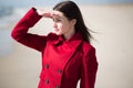 Young woman looking out into the ocean Royalty Free Stock Photo