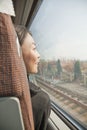 Young Woman Looking Out the Window of a Train Royalty Free Stock Photo