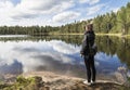 Young woman looking over the lake Royalty Free Stock Photo