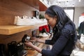 Young woman looking at shoes on display in a shop, close up Royalty Free Stock Photo