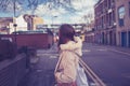 Young woman looking at street and railway line