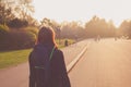 Young woman looking at sunset in park Royalty Free Stock Photo