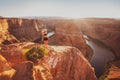 Young woman looking to Horseshoe Bend and Colorado river. Famous hiking place. Glen Canyon, Arizona, USA. Travel and Royalty Free Stock Photo
