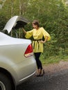 Young Woman Looking in Trunk