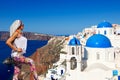 Young woman looking at Oia in Santorini, Greece Royalty Free Stock Photo