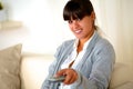 Young woman looking at you with tv remote Royalty Free Stock Photo