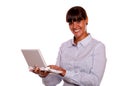 Young woman looking at you using laptop computer Royalty Free Stock Photo