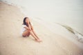 Young woman with looks lonely feel sit on the beach. Sad woman a