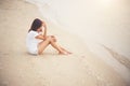 Young woman with looks lonely feel sit on the beach. Sad woman a