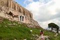 Young woman looks at Parthenon on the Acropolis of Athens, Greece. The famous ancient Greek Parthenon is the main tourist Royalty Free Stock Photo