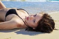 Young woman lounging at the beach Royalty Free Stock Photo