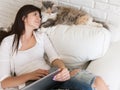 Young woman lovely looks at her cat