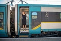 Young woman with luggage take the express train from the main station Royalty Free Stock Photo