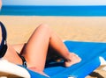 Young woman lying on a beach lounger