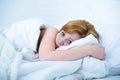 Young woman lying in bed sick unable to sleep suffering depression and nightmares insomnia sleeping disorder