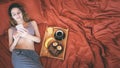 Young woman is lying in bed and surfing the net . Royalty Free Stock Photo