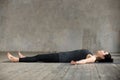 Young woman lying in Dead Body exercise Royalty Free Stock Photo