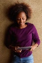 Young woman lying down with digital tablet Royalty Free Stock Photo