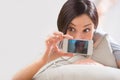 Young woman lying on the floor taking pictures and selfies Royalty Free Stock Photo