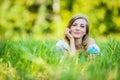 Young woman lying on grass