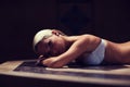 Young woman lying on hammam table in turkish bath Royalty Free Stock Photo