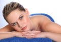 Young woman lying on health spa massage table