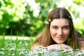Young woman lying in meadow with flowers Royalty Free Stock Photo