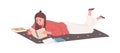 Young woman lying and reading books at home. Student studying and preparing for exam with textbooks. Female reader with