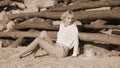 Young woman lying on sand