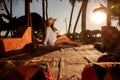 Young woman lying in straw hat in beach bar Royalty Free Stock Photo