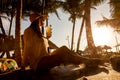 Young woman lying in straw hat in beach bar Royalty Free Stock Photo
