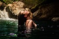 Young woman lying in the water hot spring river termales sanvicente with tropical landscape coffee region Colombia Royalty Free Stock Photo