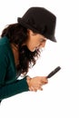 Young woman with magnifier glass and hat looking