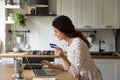 Young woman make online payment on laptop at home Royalty Free Stock Photo