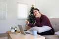 Young woman makes a purchase on the Internet on the laptop with credit card Royalty Free Stock Photo