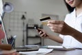 Young woman makes a purchase on the Internet on the laptop with credit card Royalty Free Stock Photo