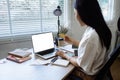 Young woman makes a purchase on the Internet on the laptop with credit card Royalty Free Stock Photo