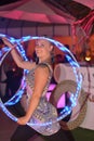 Young woman makes show with hoops in private party in Ibiza, Spain Royalty Free Stock Photo