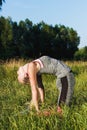 Young woman makes sport exercise