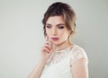 Young woman with makeup and bridal hairstyle. Pretty woman fiancee looking down, face closeup Royalty Free Stock Photo