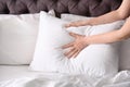 Young woman making bed Royalty Free Stock Photo
