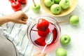 Young woman making caramel apples Royalty Free Stock Photo