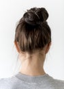 Young woman making hair bun